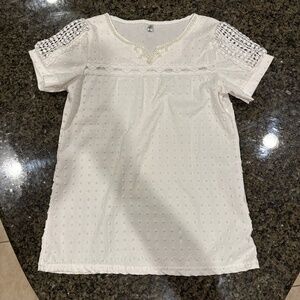 White shirt with pearl accents